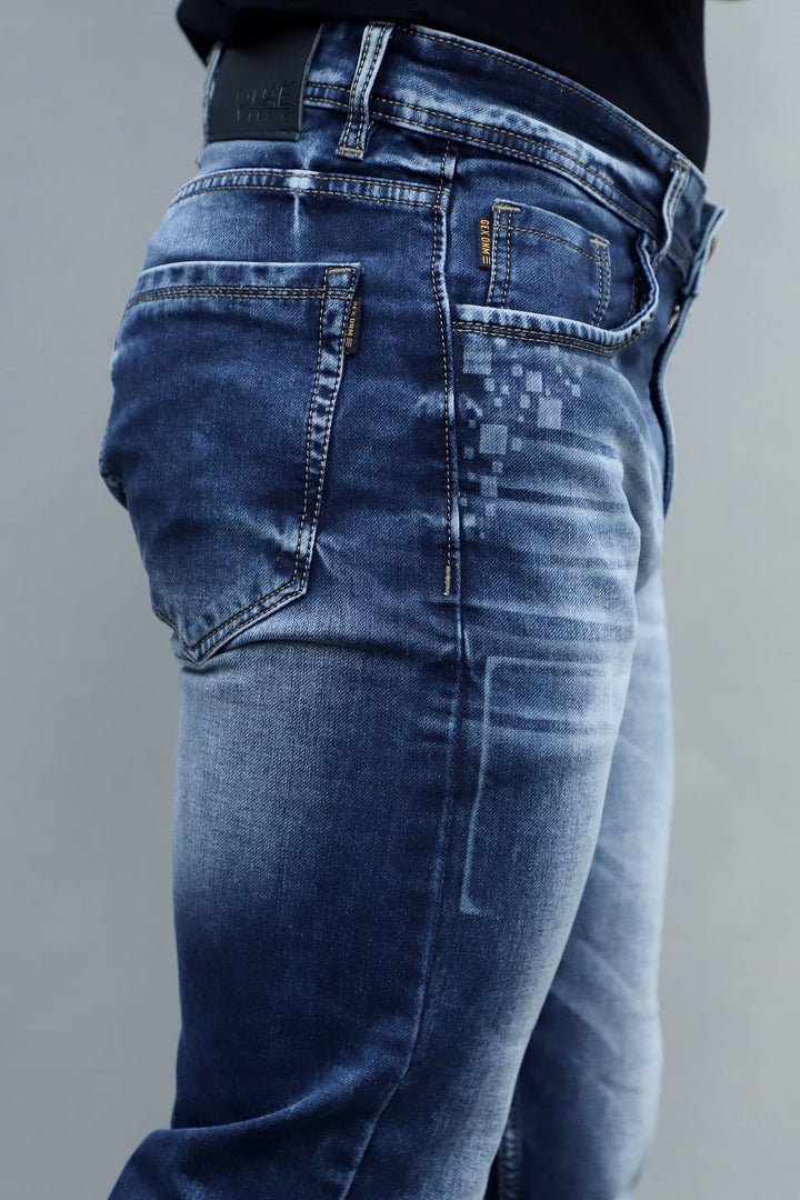 Close up of blue washed stretchable denim fabric in men's slim fit jeans E8