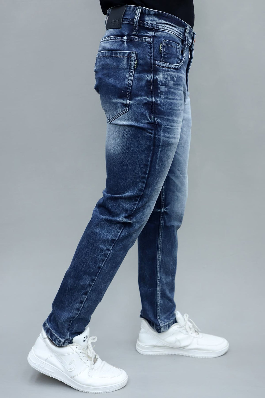 Close up of classic blue stretch denim fabric in regular fit jeans G7