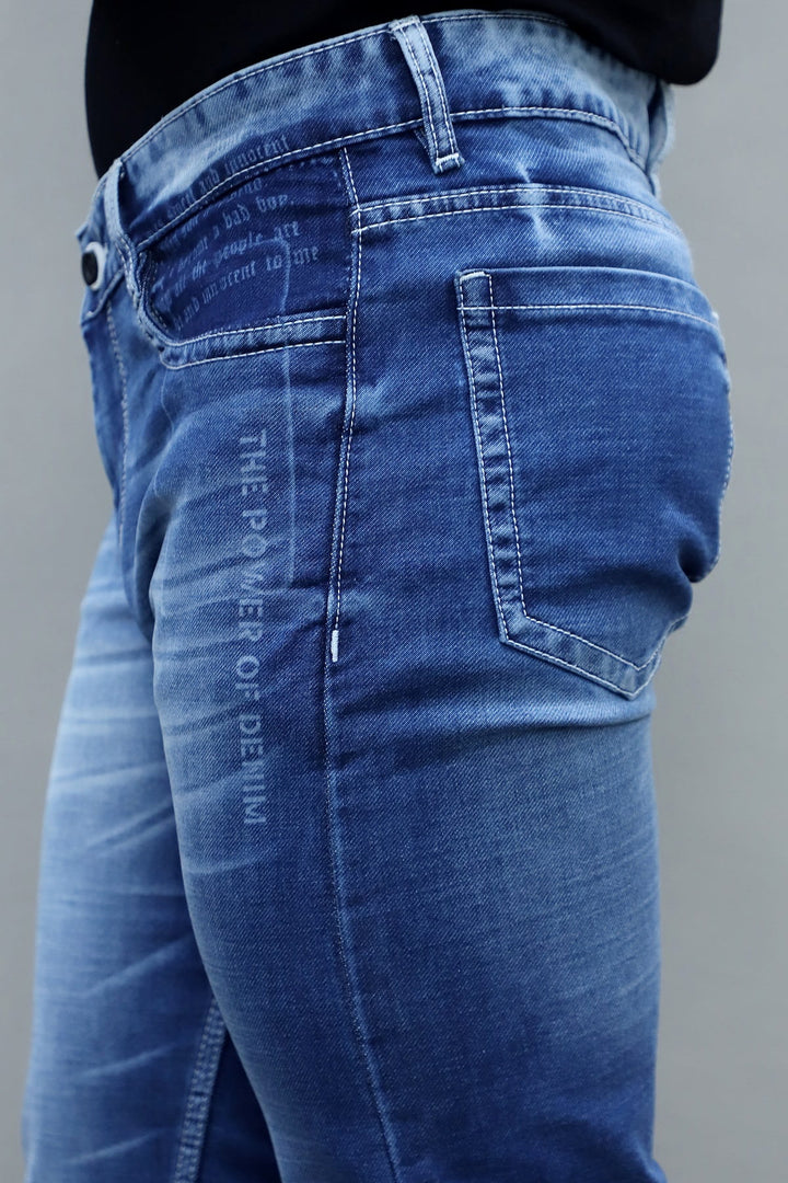 Close up of dark blue washed stretchable denim fabric in slim fit men's jeans E-16
