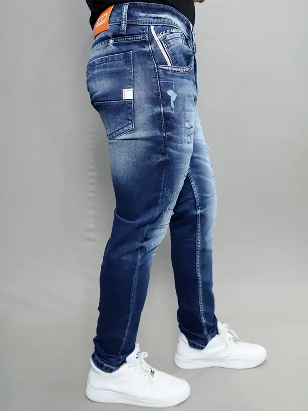 Side profile of Gex Jeans G828 navy blue denim showing patch and wash