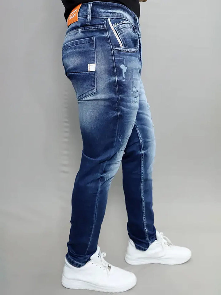 Side profile of Gex Jeans G828 navy blue denim showing patch and wash