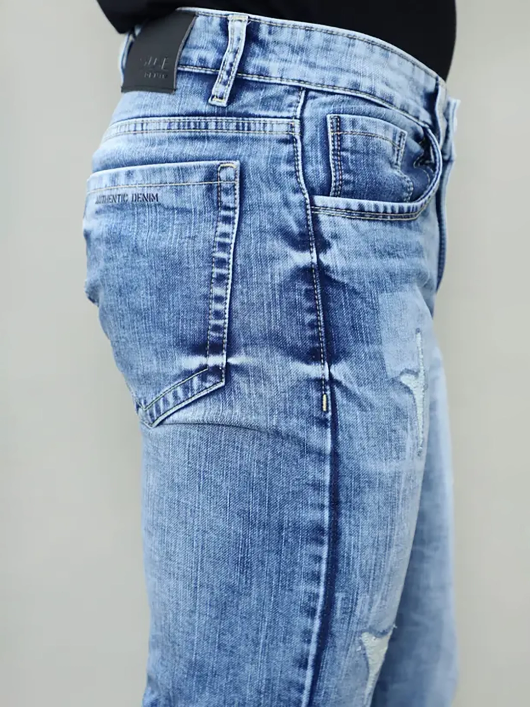 Close-up of back pocket branding and stitching on Gex Jeans G828