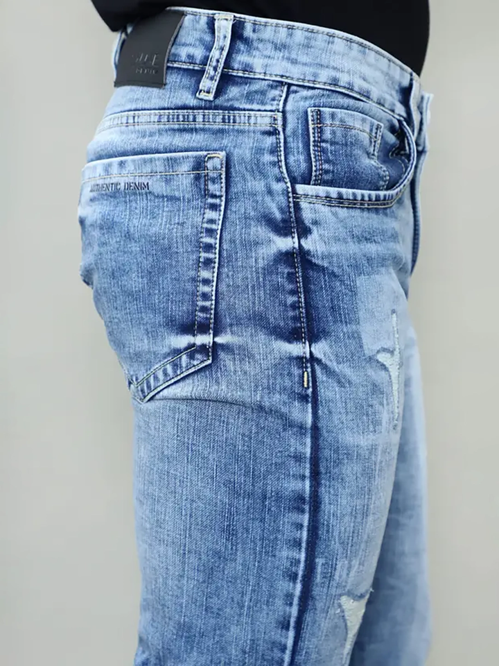 Close-up of back pocket branding and stitching on Gex Jeans G828