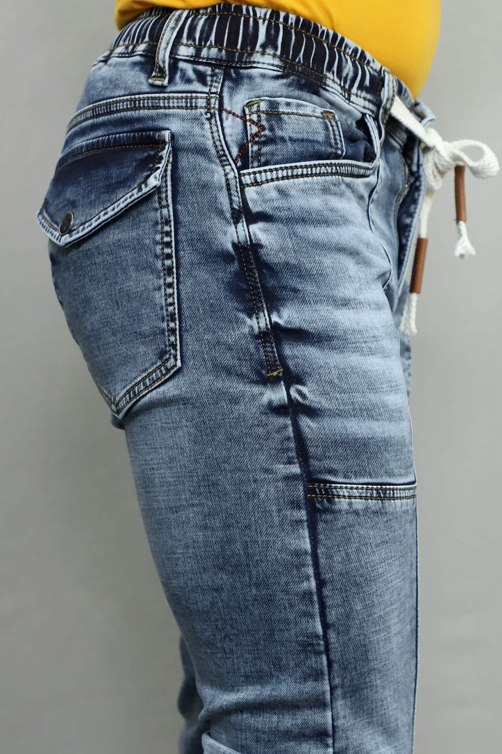 Close up of GEX men’s surgery grey jogger fit stretch jeans denim jogger showing soft stretchable grey denim fabric texture