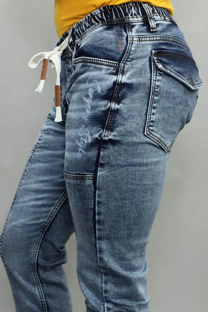 Model wearing GEX men’s surgery grey jogger fit stretch jeans article G933-denim-jogger styled for casual and sporty look