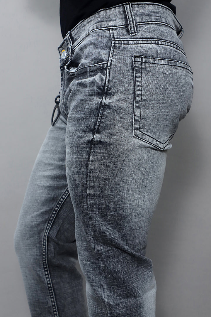 Model wearing men premium quality regular mid rise grey jeans article no Gex G1003 Plain Grey styled for casual everyday look