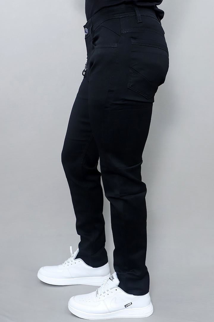 close up of men regular mid rise black denim jeans showing premium denim fabric texture
