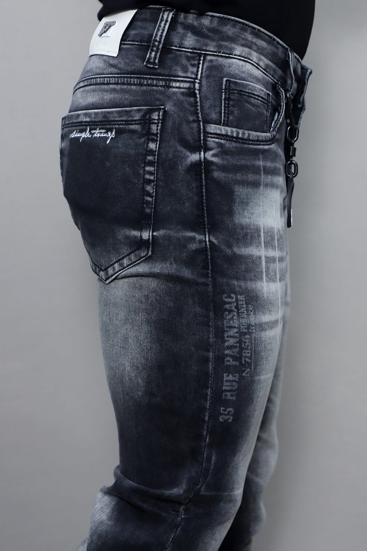 Close up of dark grey washed stretch denim fabric in men's slim fit jeans E19