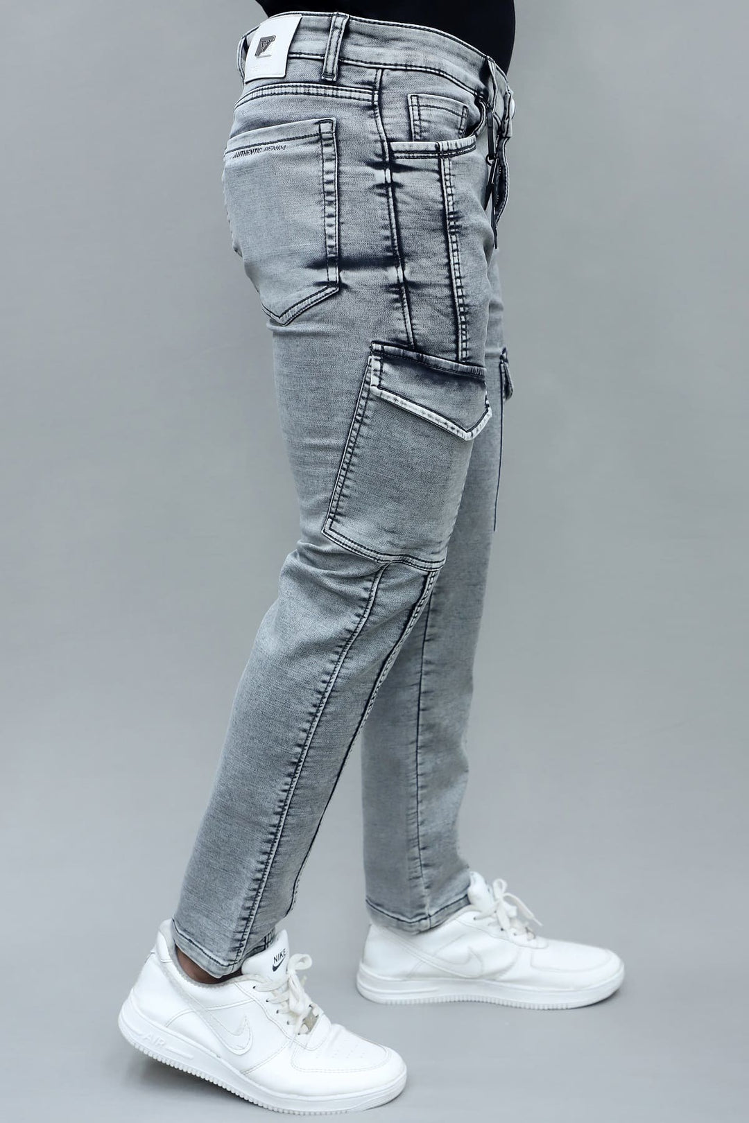 Close up of 6 pocket detail in men's slim fit light grey stretchable cargo jeans E-15