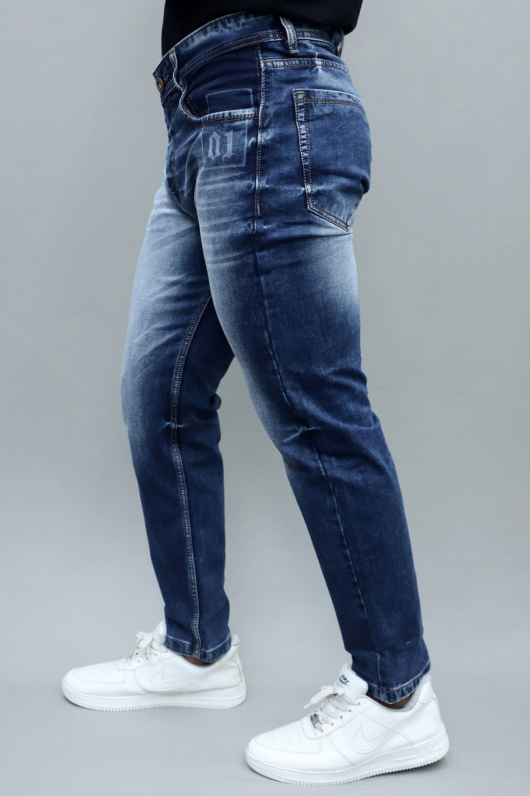Side view of men's premium blue washed slim fit stretchable jeans