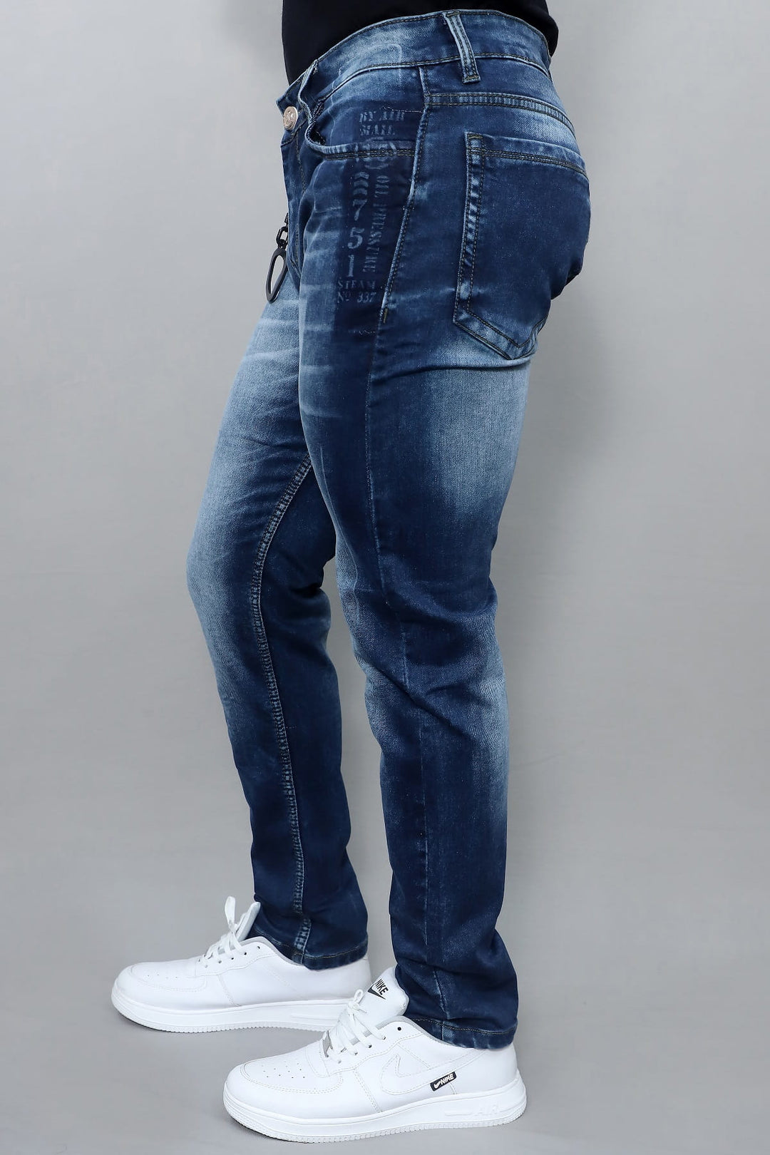 Side view of men's premium slim fit dark blue washed stretch jeans E19