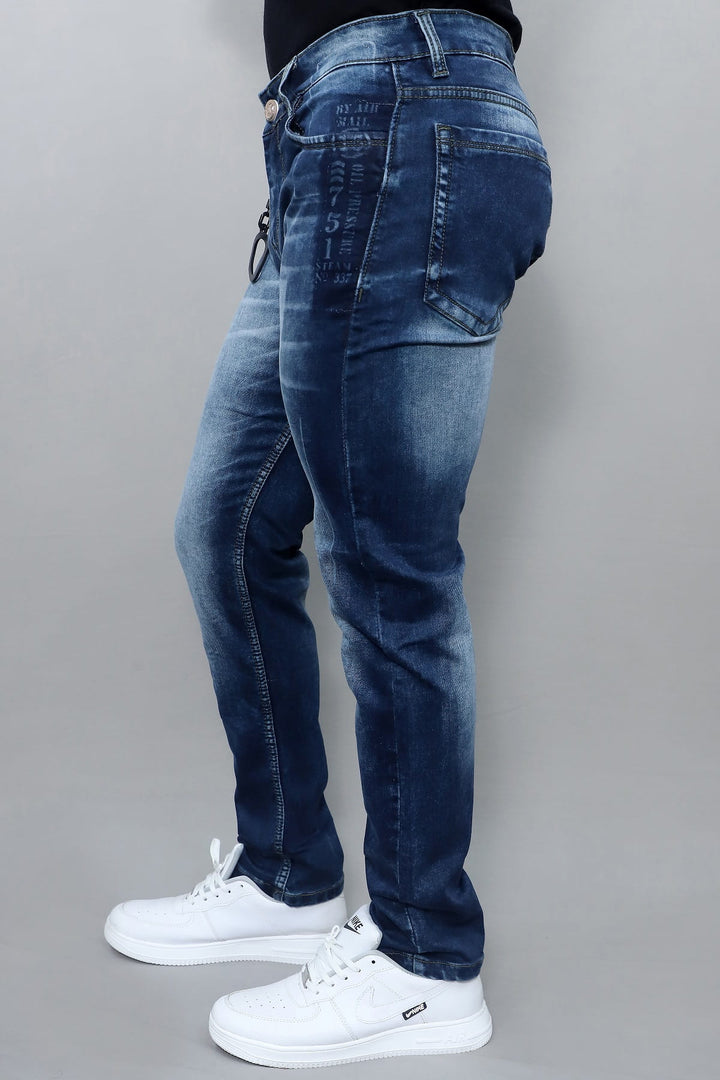 Side view of men's premium slim fit dark blue washed stretch jeans E19