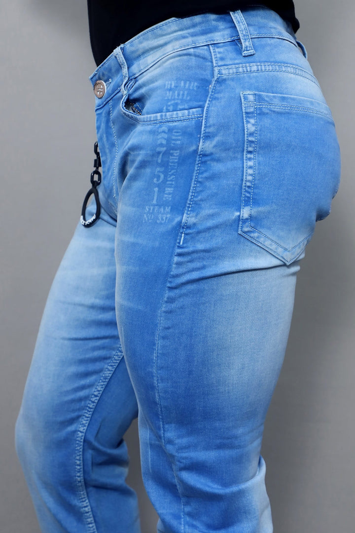 Full length view of men's slim fit sky blue washed jeans E19
