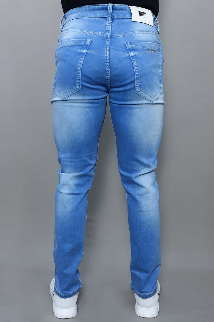 Close up of sky blue washed denim fabric in men's slim fit jeans E19