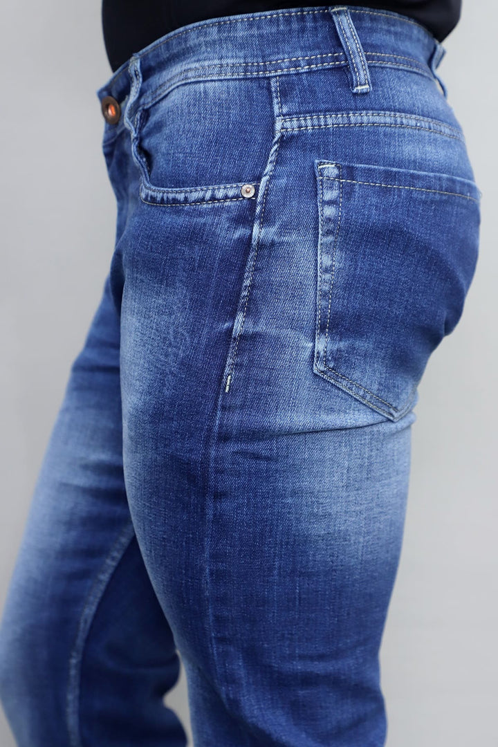 Side view of men's slim fit royal blue washed stretchable denim jeans E9