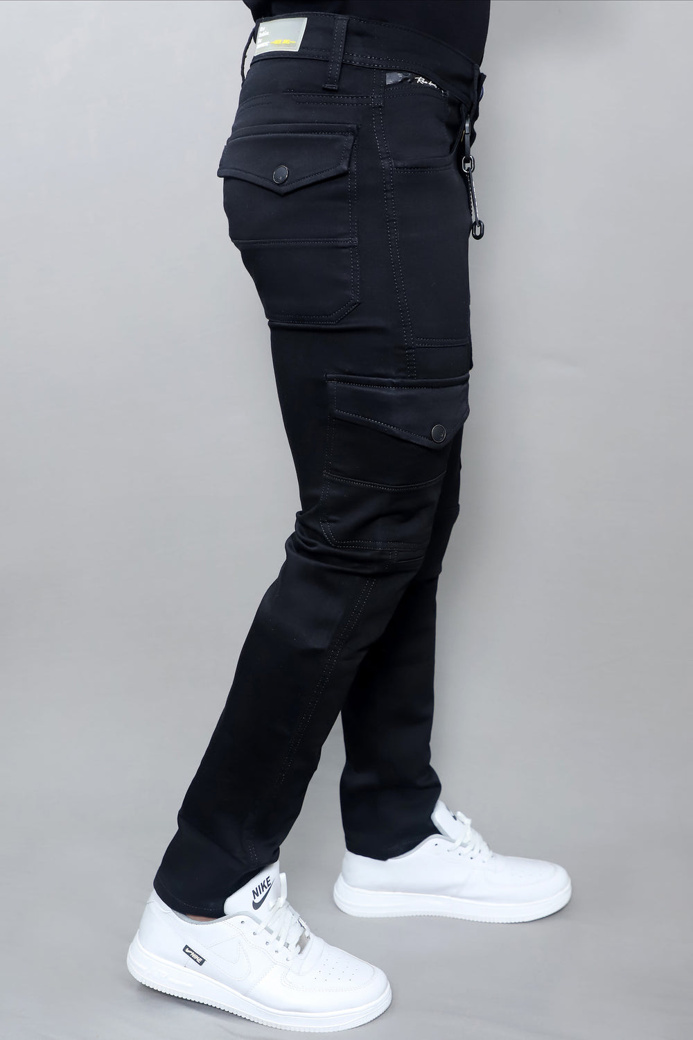 Full length view of men's slim regular fit light blue distressed stretchable denim jeans E17