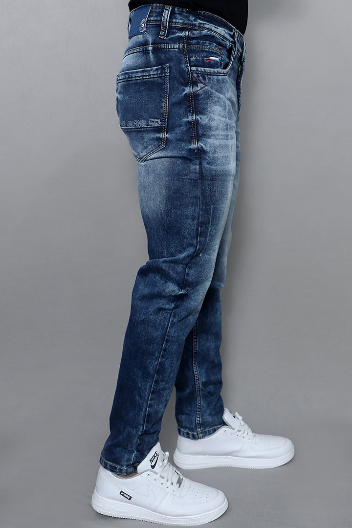 Regular fit blue jeans for men mid rise comfort plain blue back view showing clean stitching and comfortable fit